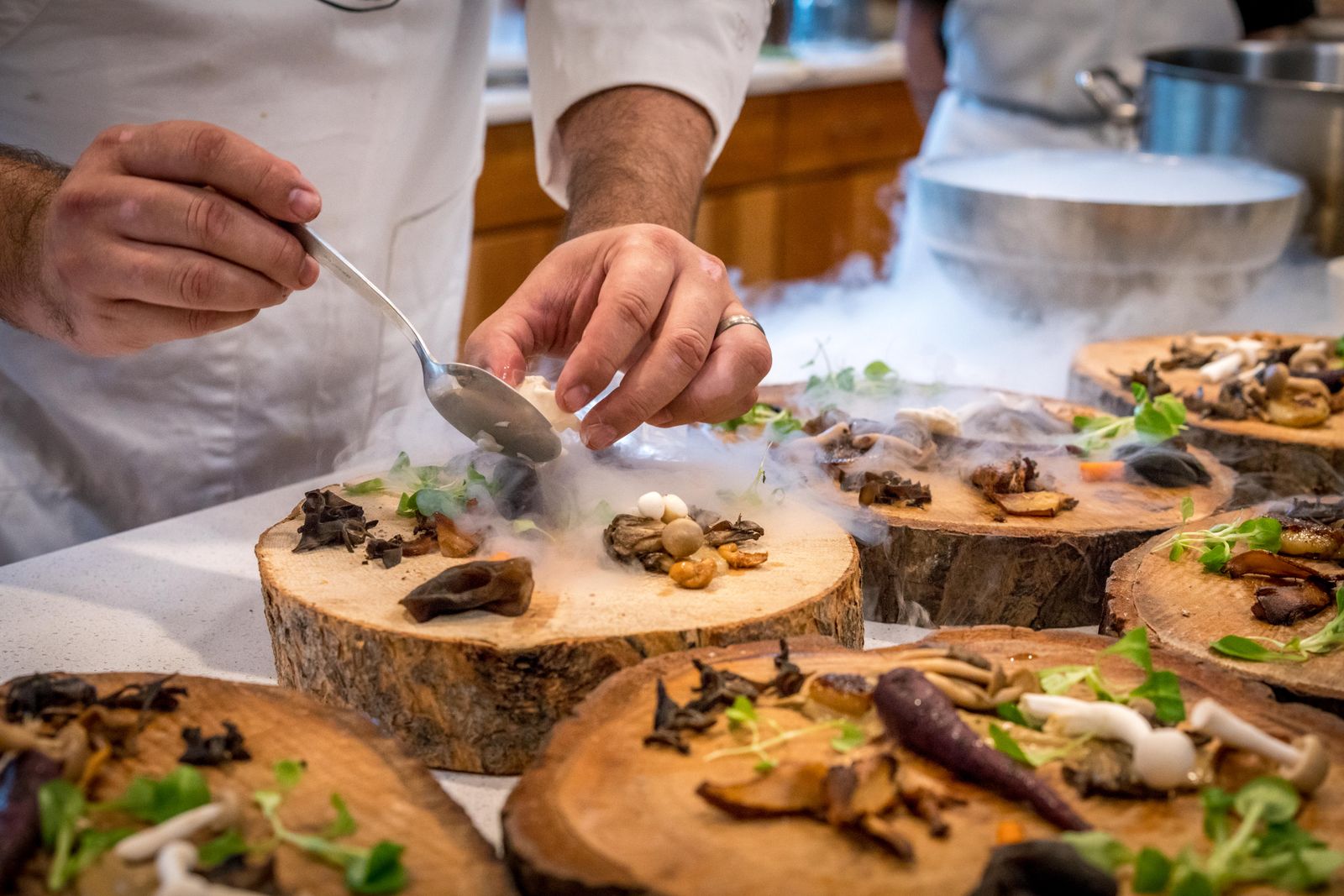 Chef plating in a restaurant kitchen